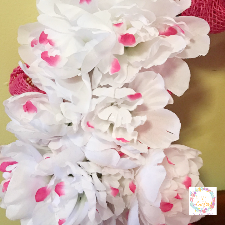 Adding Peonies to DIY spring burlap wreath from the dollar store 