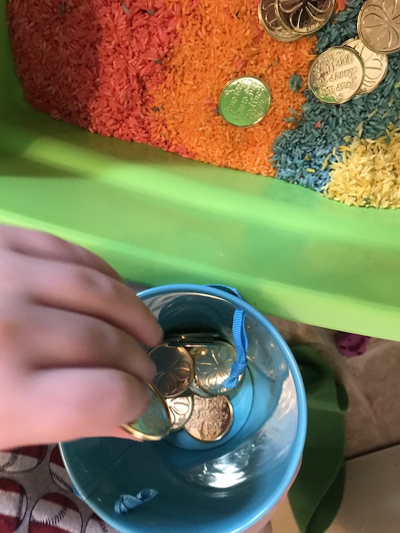 Counting gold coins during sensory play for learning