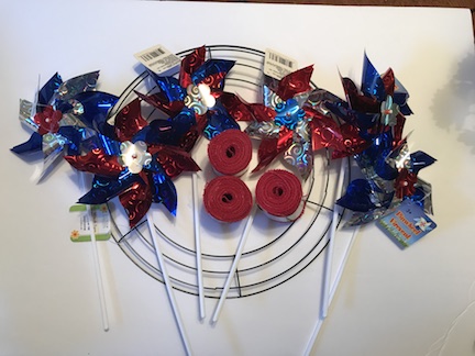 Here's a great tip- each section of the metal wreath ring, takes one roll of ribbon from the dollar store. So since I did 3 sections of the wreath in burlap, I needed 3 rolls of ribbon. 