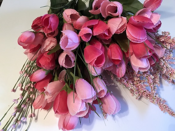 A variety of pink tulips and other floral decor for the spring tulip wreath