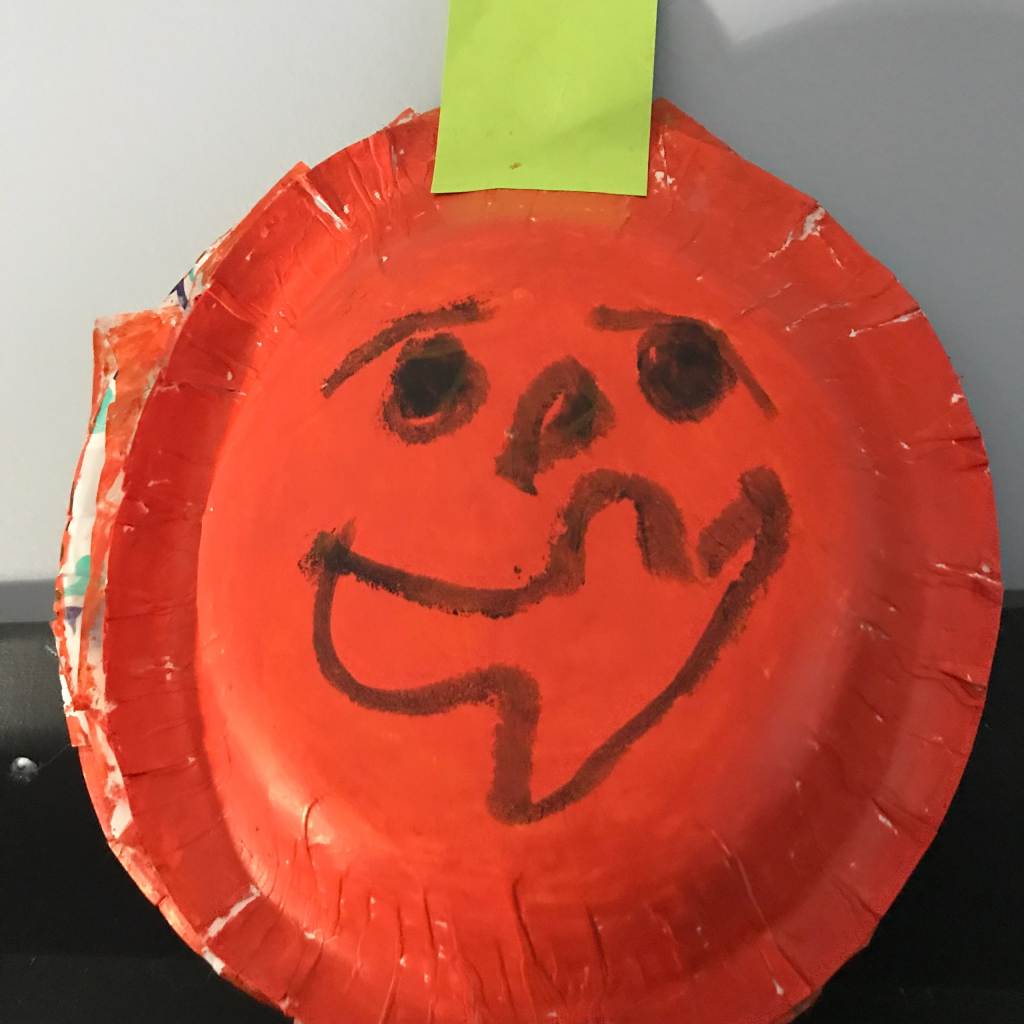 Draw a Jack o lantern face to make an easy halloween pumpkin kids craft