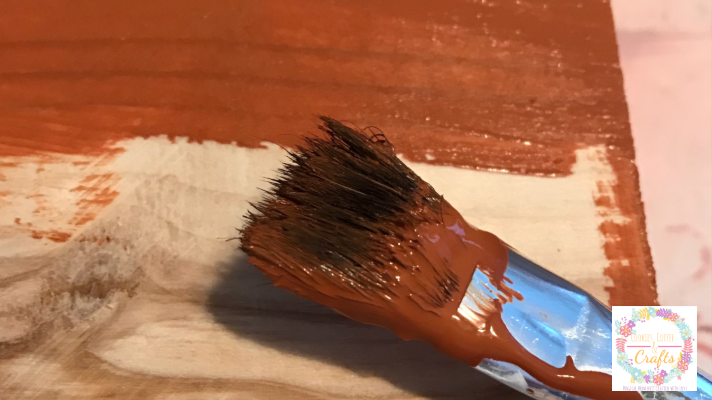 Painted scrap wood to become pumpkins for fall decor 