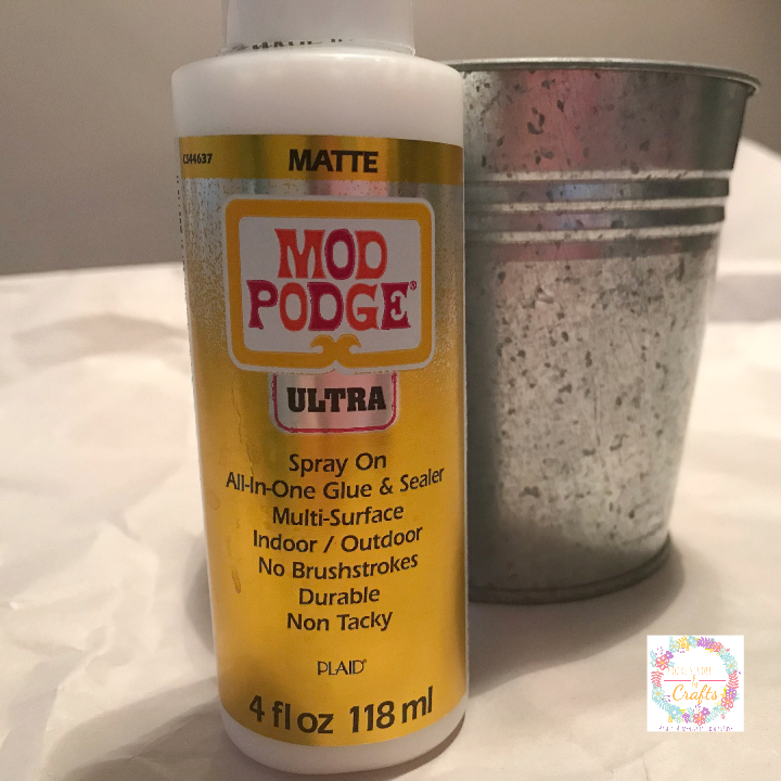 Using the matte Mod Podge ultra spray on for adding moss to the DIY Easter Decoration 