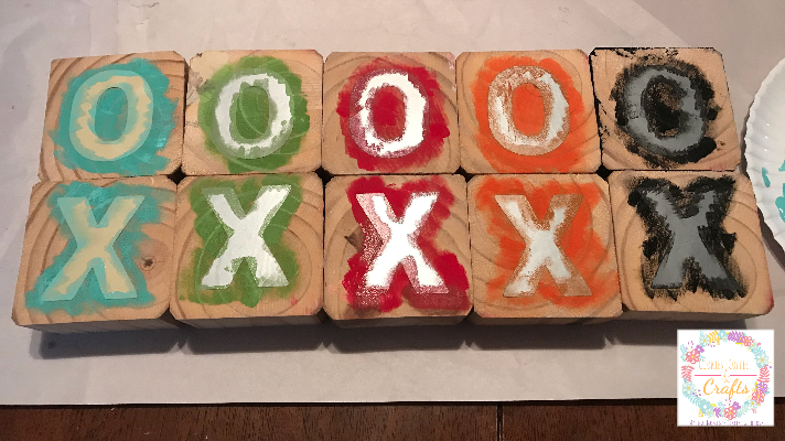 Tic Tac Toe Wooden Blocks stenciled around the X's and O's 