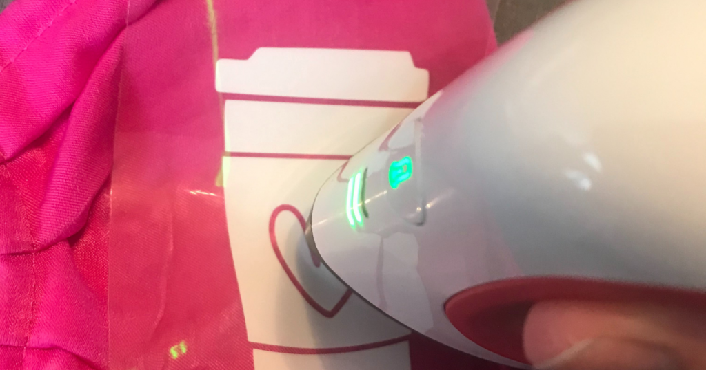 Using a Cricut Easypress mini to apply smart iron on vinyl to a face mask