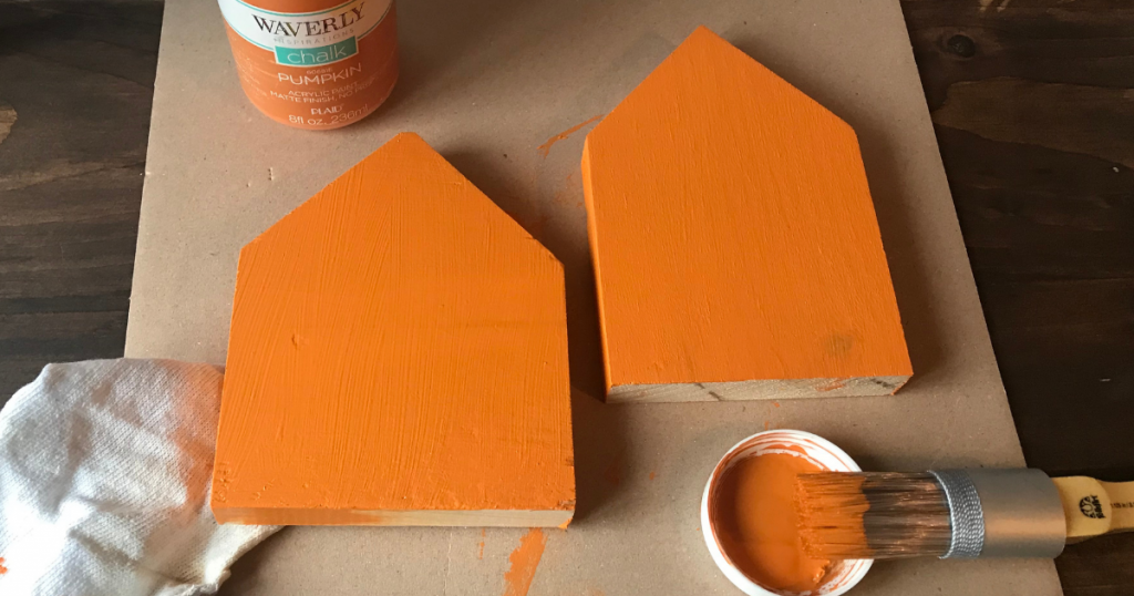 Painting the wooden houses with chalk paint