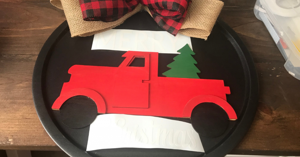 Adding the Merry Christmas with Cricut to the Christmas pizza pan craft