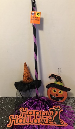Budget friendly craft and party decor with all dollar store halloween items to make a witches broom decoration