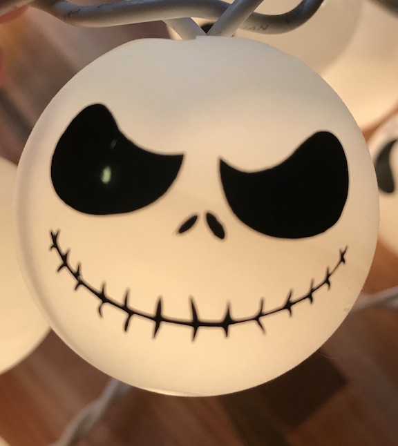  Ping Pong Ball Lights are easy and fun to make. Learn how to make these spooky halloween Jack Skellington lights. The kids and adults will love the design and creativity. #JackSkellington #NightmareBeforeChristmas #PingPongBalls #DIY #Kids #Fun #HowtoMake #HalloweenParty #Halloween #HalloweenDecor #HalloweenIdeas #Vinyl #CricutMade 