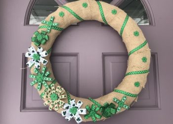 St. Patrick's Day is coming and you don't have to be Irish to decorate. Create this easy DIY Burlap St. Patrick's Day wreath for your front door. Make your home extra lucky with some four leaf clovers. #StPatricksDay #Wreaths #DIY #StPatricksDayWreath #Shamrock
