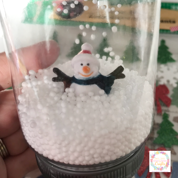fill the snowman snow globe mason jar with faux snow