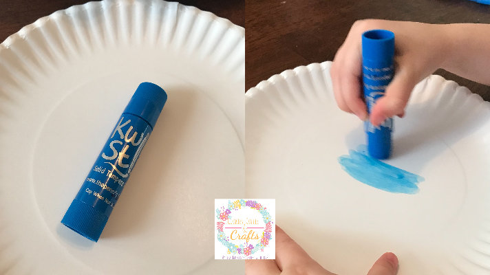 Color the paper plate blue for the ocean background 