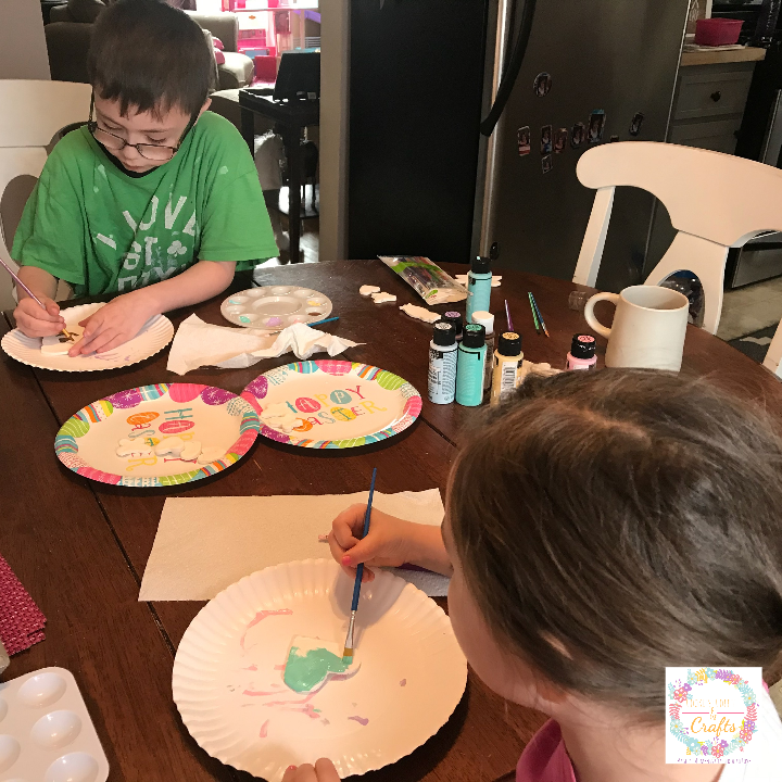The kids happily painting the magnets for Mothers Day gifts