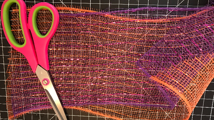 Cut the purple and orange deco mesh 12 inches long