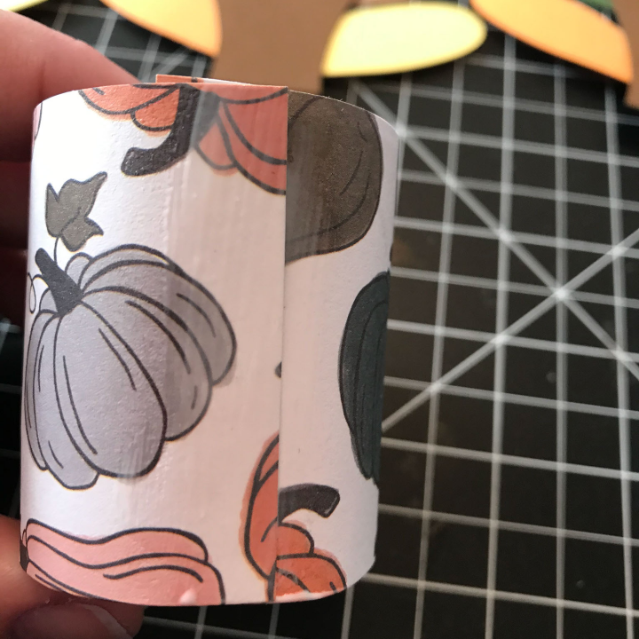 Glue the turkey to the toilet paper ring with the Mod Podge