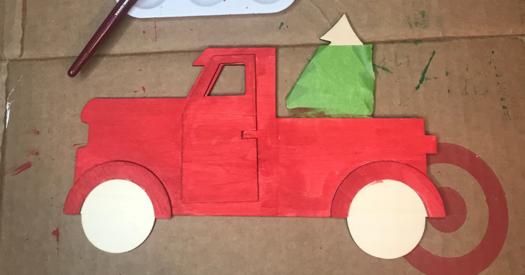 Paint the wooden truck for the pizza pan Christmas craft